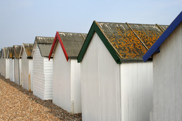 Fototapeta na wymiar Beach huts on seafront