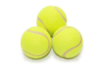 Three tennis balls isolated  on the white