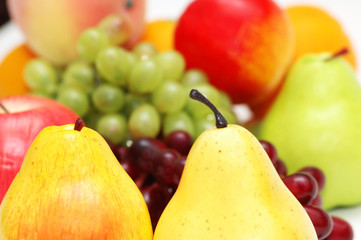 Pears and other fruits at the background