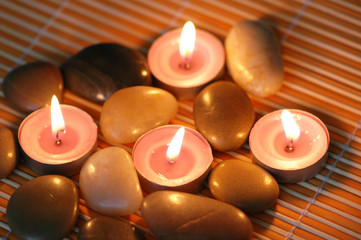 Aromatic candles and  pebbles for spa session
