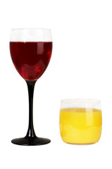 Glass with wine and a glass with juice on a white background