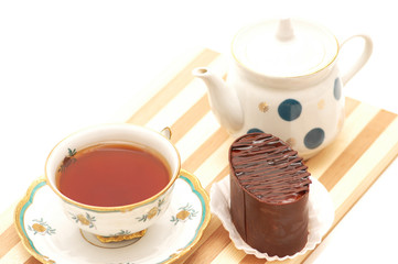 Cup of tea, chocolate cake and pot