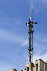 Communication antenna on a roof of a building.