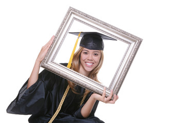 A pretty woman graduating holding a picture frame