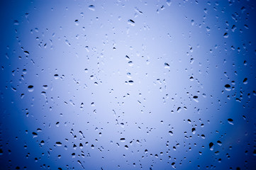 Water droplets on the blue glass