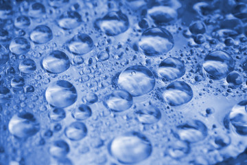 Closeup of water drops on compact disc