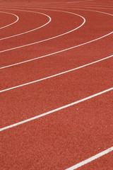 Fototapeta premium White lines going to target - lines on athletic stadium