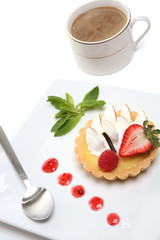 A delicious lemon dessert tart with coffee