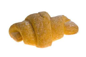 Appetizing fresh-baked golden croissant over white background
