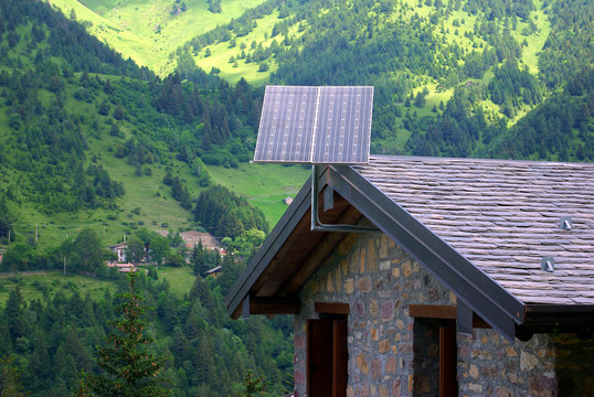 Photovoltaic panels on a log cabin