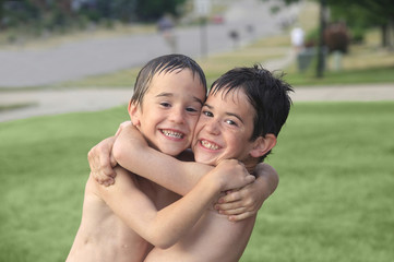 Boys Playing Outside in the Water