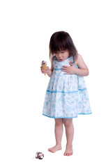 A young girl with a summertime treat. Ice cream cone.