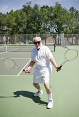 senior man on a tennis court 