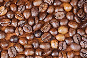 Coffee beans background (focus in the first plane)