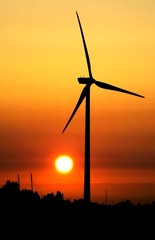 Fototapeta na wymiar wind turbine for alternative energy in sunset