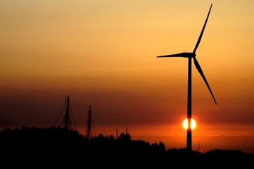 wind turbine for alternative energy in sunset