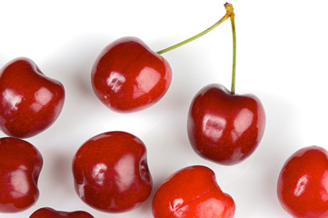 Photo of red cherriess over white background