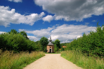 Rural belgium, historical preserved chapel on junction 