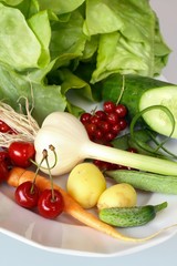 Vegetable on white plate on  of the glass table