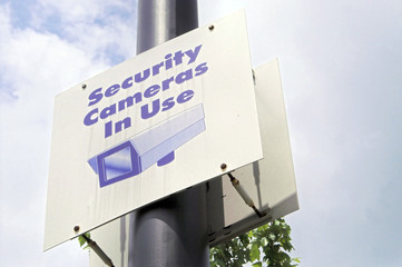 A sign warning that security cameras are in use.