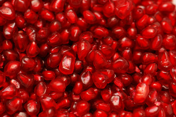 Pomegranate seeds arranged as a background