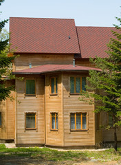 wooden rural house on sunny day