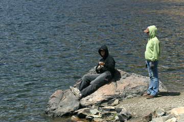 Attractive young man and woman fishing