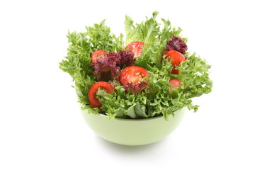 bowl of fresh lettuce and tomatoes isolated on white