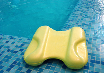 board float for swim lie on the coast in swimming pool