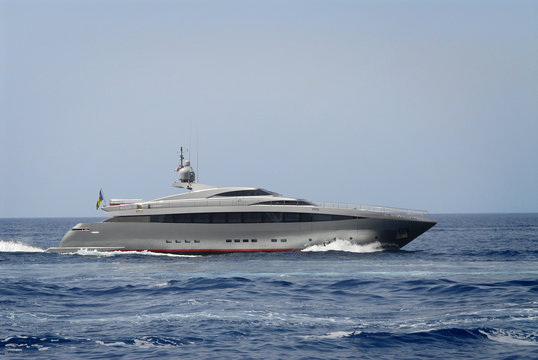 beautiful silver luxury yacht off the Island of Capri