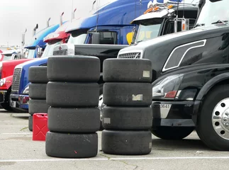 Zelfklevend Fotobehang Racing tires, stacked © Dennis Oblander