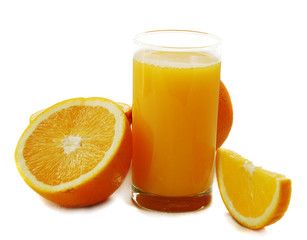 glass of orange juice and oranges