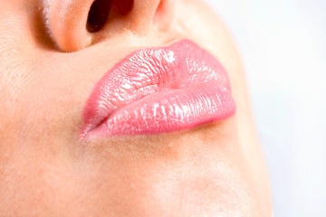 Obraz premium Close up shot of young woman making lips for kissing