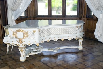 White ancient grand piano 