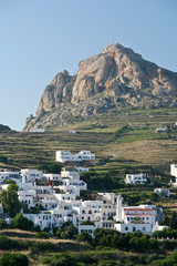 A typical Greek island village under a rock in Tinos island
