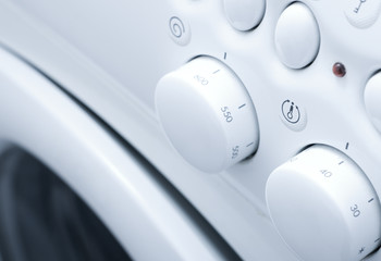 White washing machine with button close up