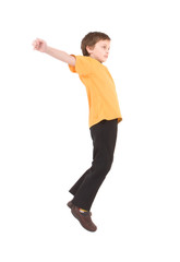 Young boy jumping up isolated on white