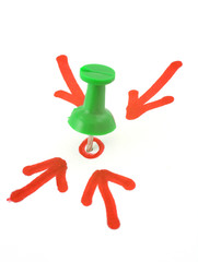 thumbtack placed in the centre, four red arrows pointing at it, 