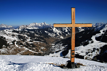 A cross at the top of the mountains in Saalbach, Austria