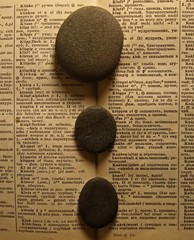 book and three rocks