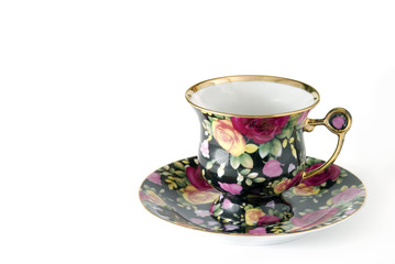 Porcelain cup decorated by roses (handiwork)