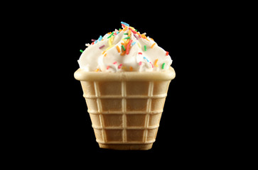 Sweet marshmallow cone with colored cake sprinkles.
