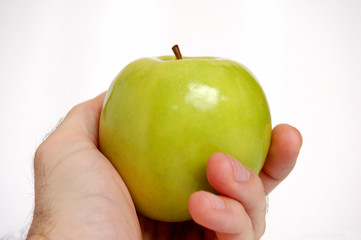 Hand holding an apple