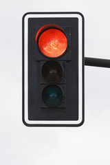 Black traffic-ligth with red light on