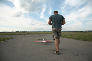 The man and model of the plane in air station