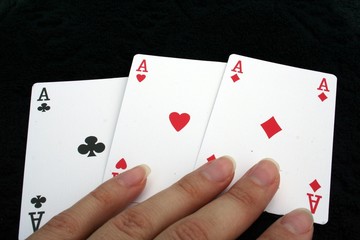 touching 3 aces cards