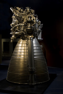 Close up shot of a rocket engine on a dark background.