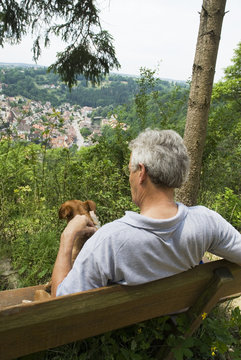 man and dog enjoys the viewpoint