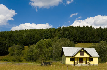 Weekend house in the mountains on a sunny day