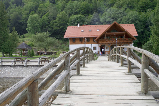 Mountain chalet with wooden bridge in front